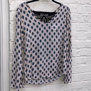 Patten blouse with back crochet detail.